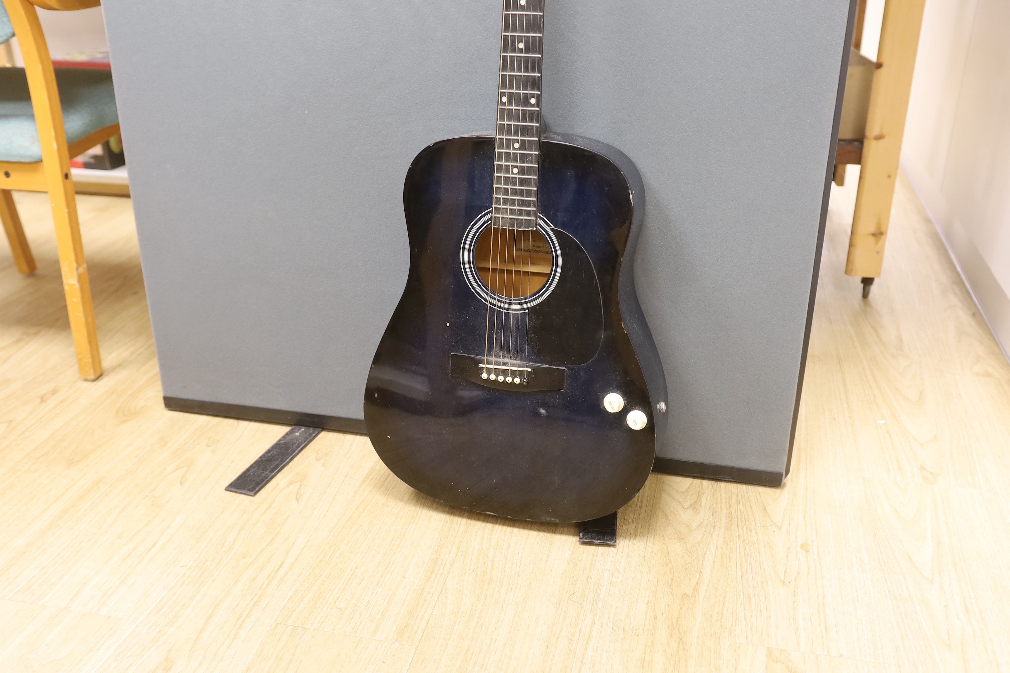 A Martin Smith electro-acoustic guitar in a Ritter soft case